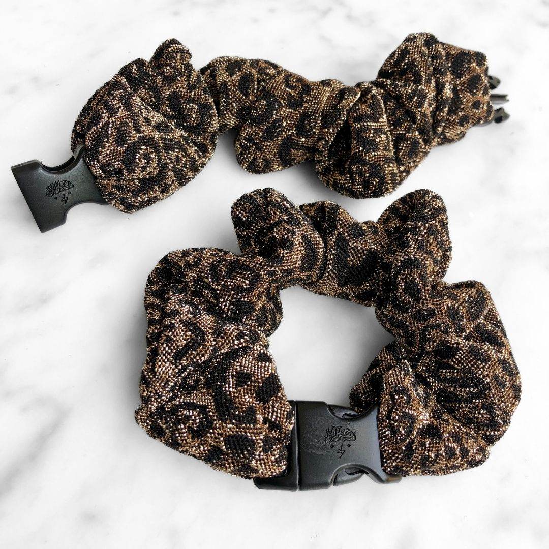 Best hair tie elastics and scrunchie hair accessories for snag-free, pull-free, rip-free, hair. Smooth, effortless hair ties and hair scrunchies for athletes, active moms, fitness, & sports. Spotted Spark - Sparkly Leopard Print Buckle Scrunchie - No Snagging, No Tangles