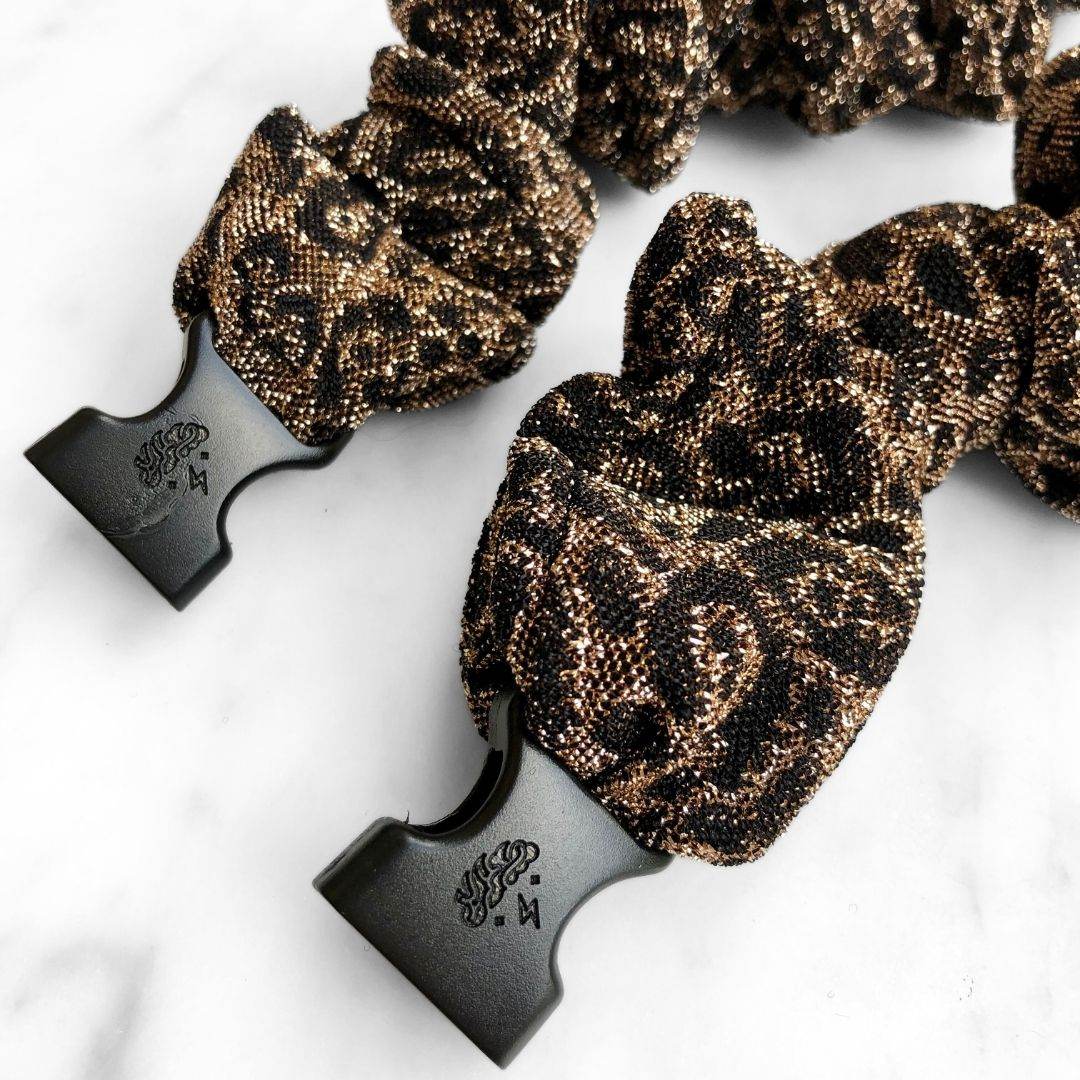 Best hair tie elastics and scrunchie hair accessories for snag-free, pull-free, rip-free, hair. Smooth, effortless hair ties and hair scrunchies for athletes, active moms, fitness, & sports. Spotted Spark - Sparkly Leopard Print Buckle Scrunchie - No Snagging, No Tangles