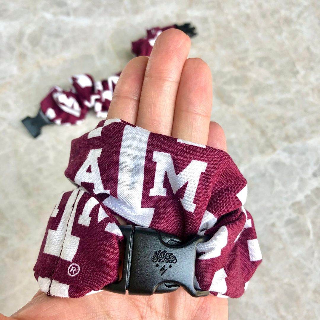 Best hair tie elastics and scrunchie hair accessories for snag-free, pull-free, rip-free, hair. Smooth, effortless hair ties and hair scrunchies for athletes, active moms, fitness, & sports. A&M Aggies Buckle Scrunchie - No Snagging, No Tangles