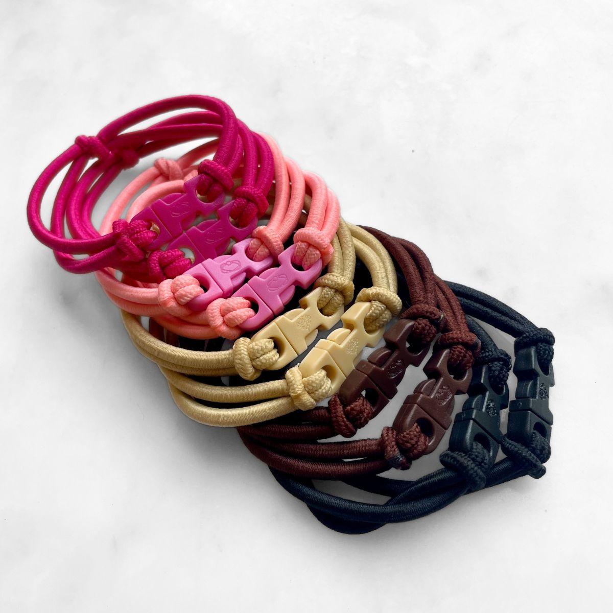 Snag free Buckle Hair Ties in Industrial Black, Chocolate Brown, Champagne Blonde, Baby Pink and Hot Pink