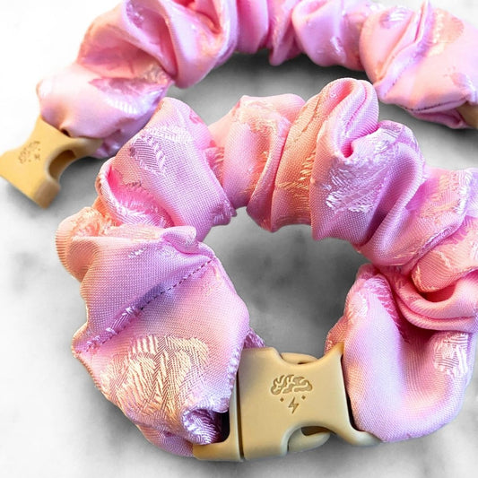 Pink floral jacquard fabric detail on the Empress Buckle Scrunchie