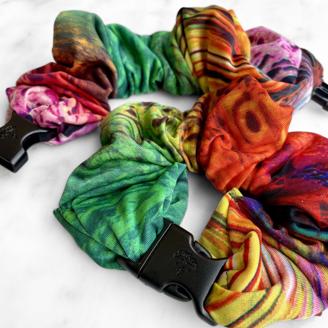 Jungle leaf heatmap print fabric detail on the jumbo Buckle Scrunchie