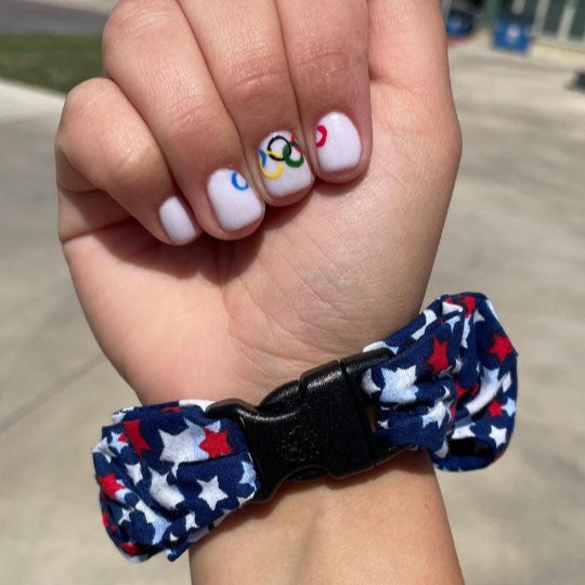 Best hair tie elastics and scrunchie hair accessories for snag-free, pull-free, rip-free, hair. Smooth, effortless hair ties and hair scrunchies for athletes, active moms, fitness, & sports. Team USA "Shooting" Stars Patriotic Buckle Scrunchie - No Snagging, No Tangles