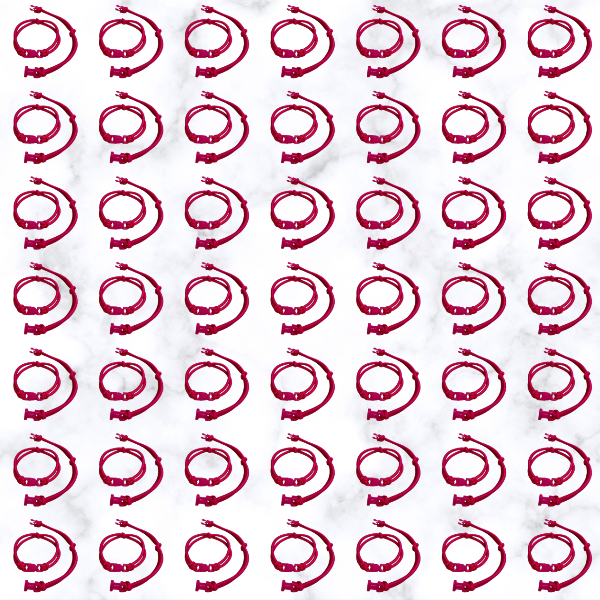 Grid of Hot Pink Buckle Hair Tie elastics on marble, 100 pack for cheer, volleyball, and Pink Out games
