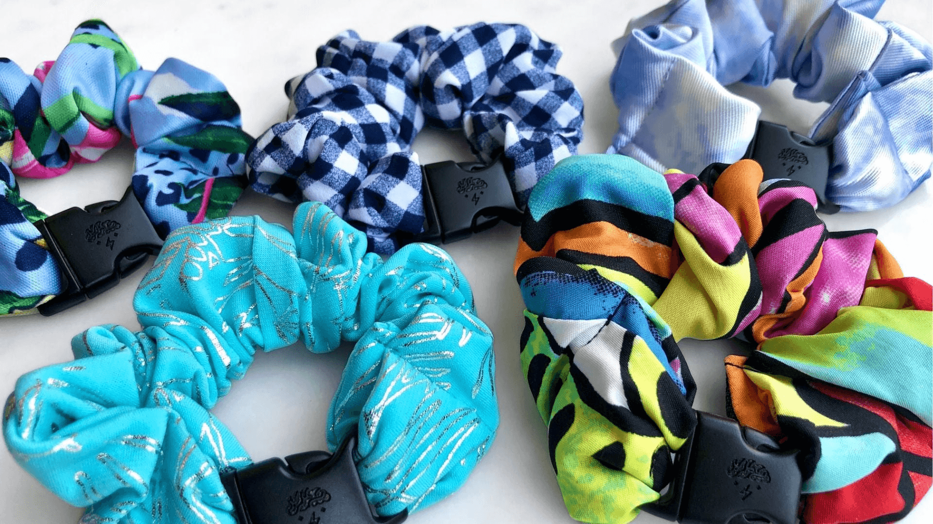 Best hair tie elastics and scrunchie hair accessories for snag-free, pull-free, rip-free, hair. Smooth, effortless hair ties and hair scrunchies for athletes, active moms, fitness, &amp; sports. Summer Buckle Scrunchies - Buckle Scrunchies