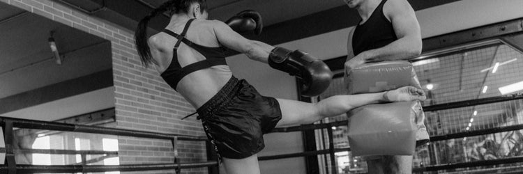 Karate gifts: Two women sparring in a kickboxing gym