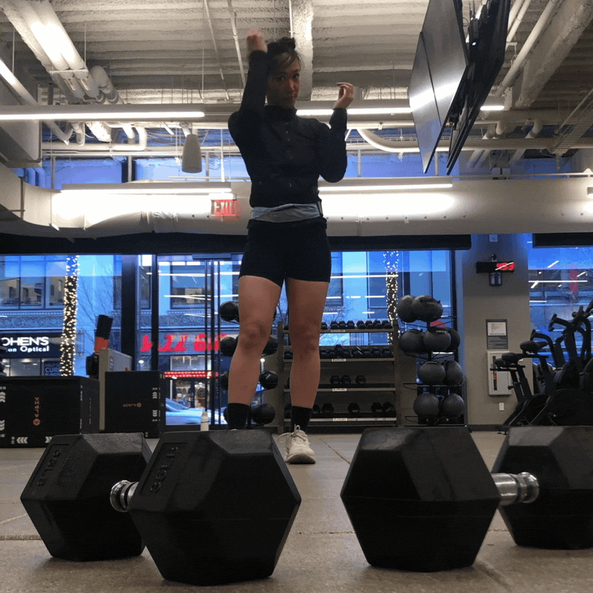 Skateboarding Scrunchies & Hair Ties: Woman doing pull-ups in a gym with her hair in a Buckle Scrunchie