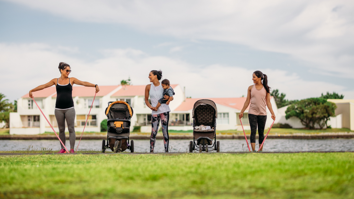 Mother daughter gifts: Family walking outdoors on a sunny path