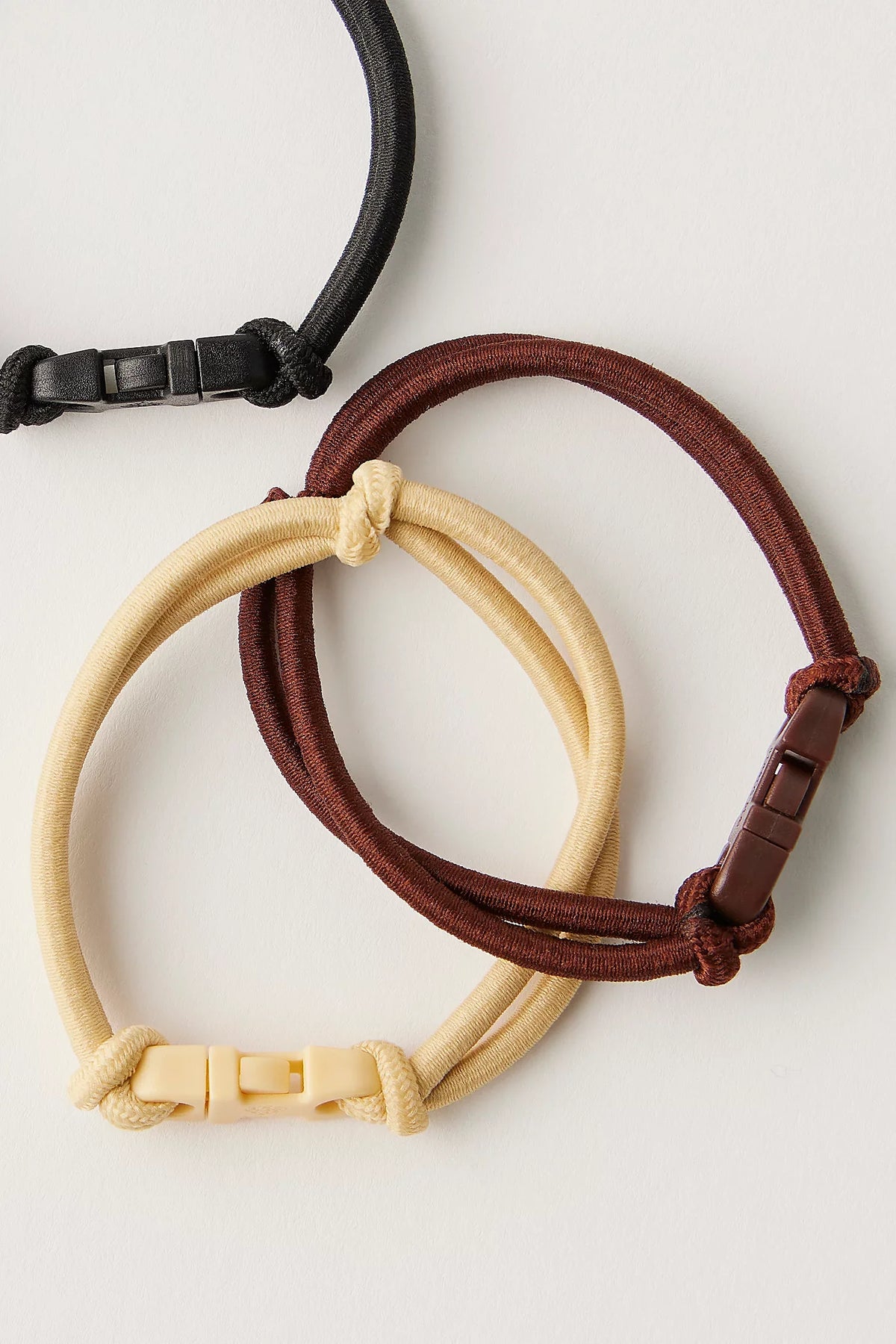 Best Brown Hair Ties: Tan and brown Buckle Hair Ties on a white surface