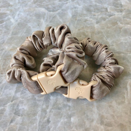 Best hair tie elastics and scrunchie hair accessories for snag-free, pull-free, rip-free, hair. Smooth, effortless hair ties and hair scrunchies for athletes, active moms, fitness, & sports. Blush Gold Buckle Scrunchie - No Snagging, No Tangles Blush Gold Recycled Polyblend Mini (0.75 to 1 inch thickness)