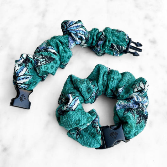 Best zero tangle no pull hair tie elastics and scrunchie hair accessories for snag-free, pull-free, rip-free, hair. Smooth, effortless hair ties and hair scrunchies for athletes, active moms, fitness, & sports. Tropic Teal Floral Buckle Scrunchie - No Snagging, No Tangles Tropic Teal Recycled Polyblend