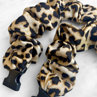 Best zero tangle no pull hair tie elastics and scrunchie hair accessories for snag-free, pull-free, rip-free, hair. Smooth, effortless hair ties and hair scrunchies for athletes, active moms, fitness, & sports. Prowl Leopard Print Buckle Scrunchie - No Snagging, No Tangles