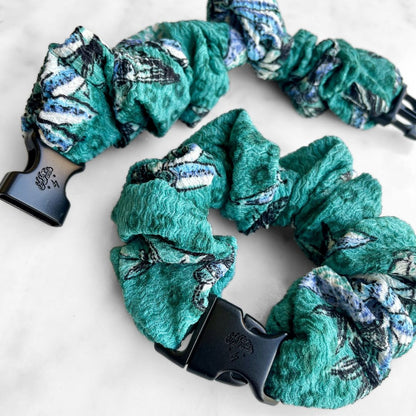 Best zero tangle no pull hair tie elastics and scrunchie hair accessories for snag-free, pull-free, rip-free, hair. Smooth, effortless hair ties and hair scrunchies for athletes, active moms, fitness, & sports. Tropic Teal Floral Buckle Scrunchie - No Snagging, No Tangles