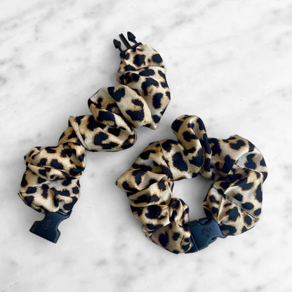 Best zero tangle no pull hair tie elastics and scrunchie hair accessories for snag-free, pull-free, rip-free, hair. Smooth, effortless hair ties and hair scrunchies for athletes, active moms, fitness, & sports. Prowl Leopard Print Buckle Scrunchie - No Snagging, No Tangles