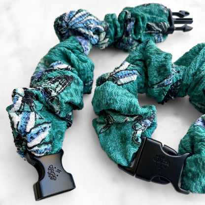 Best zero tangle no pull hair tie elastics and scrunchie hair accessories for snag-free, pull-free, rip-free, hair. Smooth, effortless hair ties and hair scrunchies for athletes, active moms, fitness, & sports. Tropic Teal Floral Buckle Scrunchie - No Snagging, No Tangles