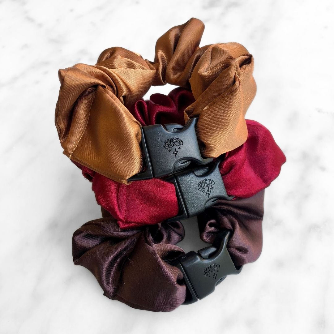 Best hair tie elastics and scrunchie hair accessories for snag-free, pull-free, rip-free, hair. Smooth, effortless hair ties and hair scrunchies for athletes, active moms, fitness, & sports. Fall Essentials - 3-Pack Autumn Halloween Buckle Scrunchies - No Snagging, No Tangles Satin Standard (1.25 to 1.5 inch thickness)
