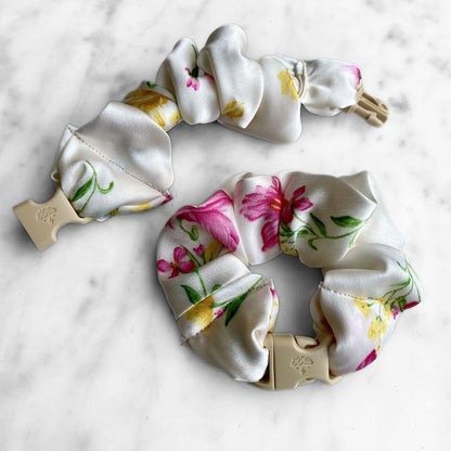 Best zero tangle no pull hair tie elastics and scrunchie hair accessories for snag-free, pull-free, rip-free, hair. Smooth, effortless hair ties and hair scrunchies for athletes, active moms, fitness, & sports. Lily Ivory Floral Buckle Scrunchie - No Snagging, No Tangles