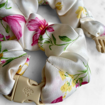 Best zero tangle no pull hair tie elastics and scrunchie hair accessories for snag-free, pull-free, rip-free, hair. Smooth, effortless hair ties and hair scrunchies for athletes, active moms, fitness, & sports. Lily Ivory Floral Buckle Scrunchie - No Snagging, No Tangles