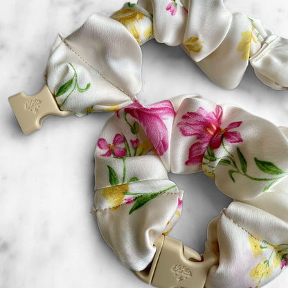 Best zero tangle no pull hair tie elastics and scrunchie hair accessories for snag-free, pull-free, rip-free, hair. Smooth, effortless hair ties and hair scrunchies for athletes, active moms, fitness, & sports. Lily Ivory Floral Buckle Scrunchie - No Snagging, No Tangles