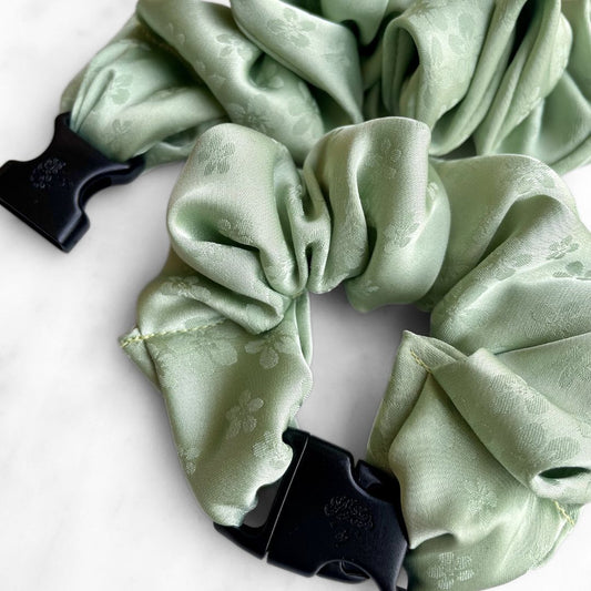 Best zero tangle no pull hair tie elastics and scrunchie hair accessories for snag-free, pull-free, rip-free, hair. Smooth, effortless hair ties and hair scrunchies for athletes, active moms, fitness, & sports. Petal Sage Floral Buckle Scrunchie - No Snagging, No Tangles