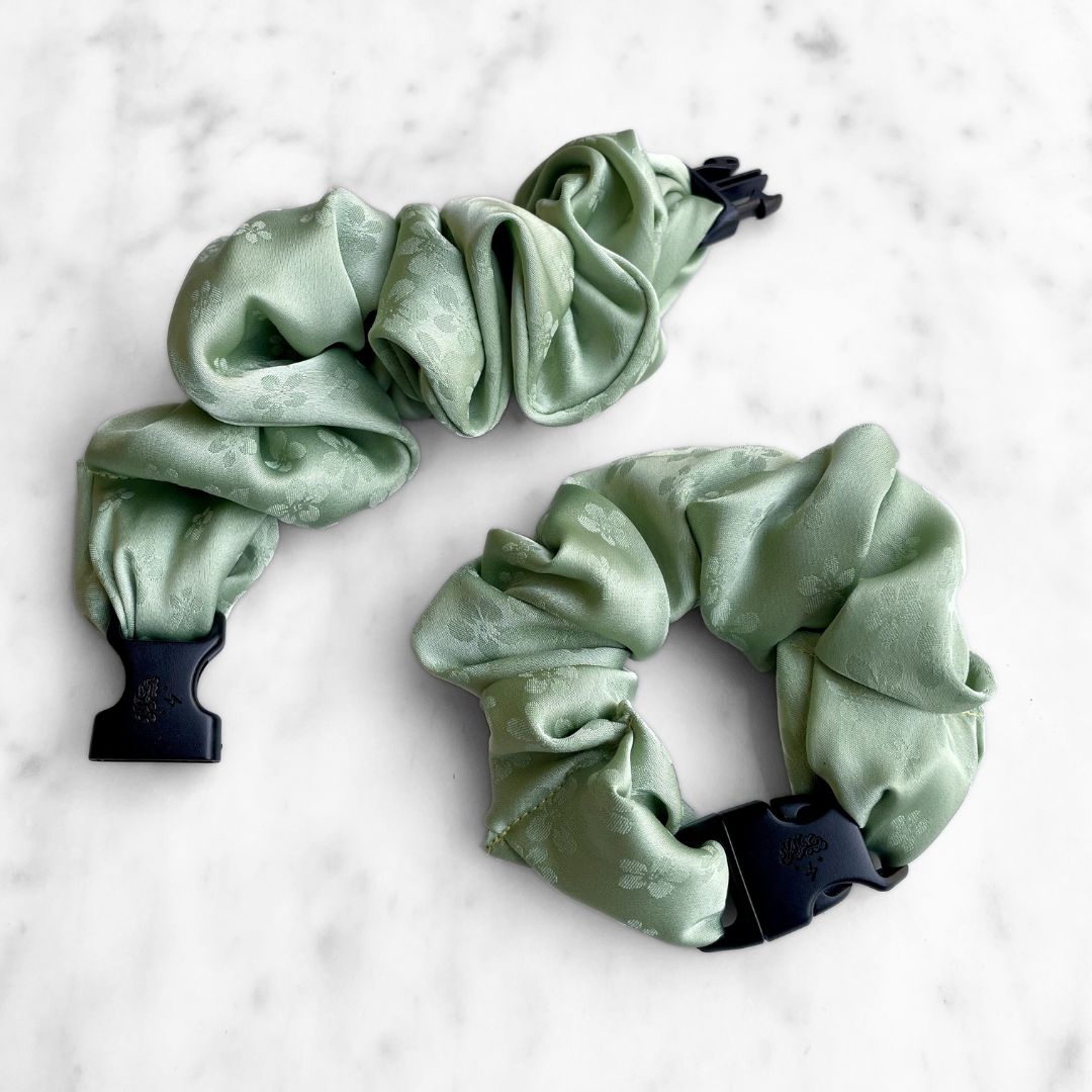 Best zero tangle no pull hair tie elastics and scrunchie hair accessories for snag-free, pull-free, rip-free, hair. Smooth, effortless hair ties and hair scrunchies for athletes, active moms, fitness, & sports. Petal Sage Floral Buckle Scrunchie - No Snagging, No Tangles
