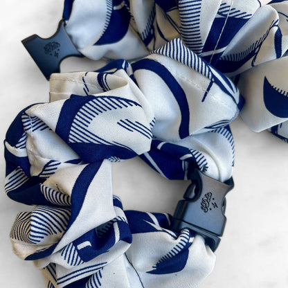 Best zero tangle no pull hair tie elastics and scrunchie hair accessories for snag-free, pull-free, rip-free, hair. Smooth, effortless hair ties and hair scrunchies for athletes, active moms, fitness, & sports. Palm Beach Navy Buckle Scrunchie - No Snagging, No Tangles