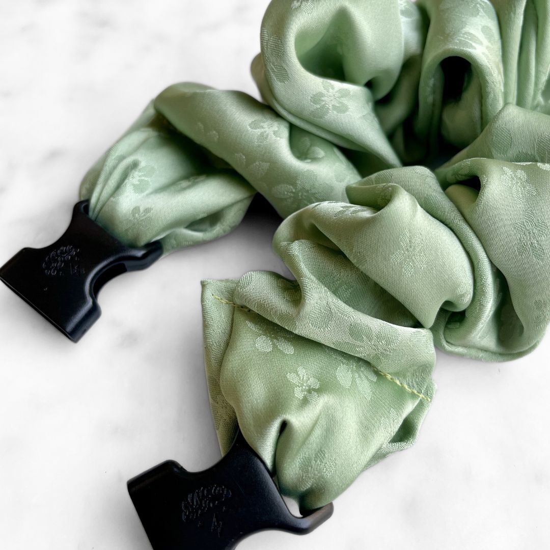 Best zero tangle no pull hair tie elastics and scrunchie hair accessories for snag-free, pull-free, rip-free, hair. Smooth, effortless hair ties and hair scrunchies for athletes, active moms, fitness, & sports. Petal Sage Floral Buckle Scrunchie - No Snagging, No Tangles