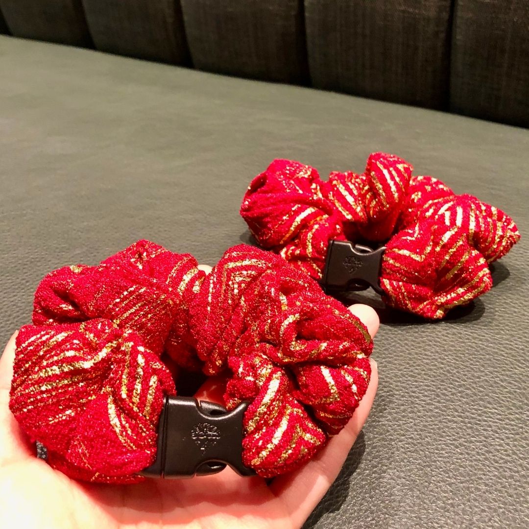 Best hair tie elastics and scrunchie hair accessories for snag-free, pull-free, rip-free, hair. Smooth, effortless hair ties and hair scrunchies for athletes, active moms, fitness, & sports. Merry & Bright Red Holiday Buckle Scrunchie - No Snagging, No Tangles