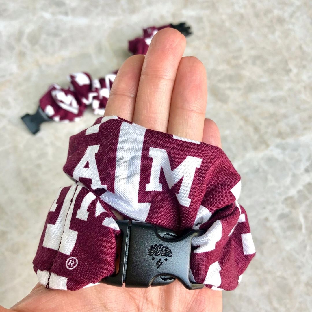 Best hair tie elastics and scrunchie hair accessories for snag-free, pull-free, rip-free, hair. Smooth, effortless hair ties and hair scrunchies for athletes, active moms, fitness, & sports. A&M Aggies Buckle Scrunchie - No Snagging, No Tangles