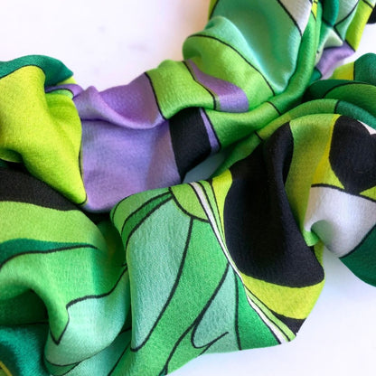 Best zero tangle no pull hair tie elastics and scrunchie hair accessories for snag-free, pull-free, rip-free, hair. Smooth, effortless hair ties and hair scrunchies for athletes, active moms, fitness, & sports. Lucky Green Buckle Scrunchie - No Snagging, No Tangles