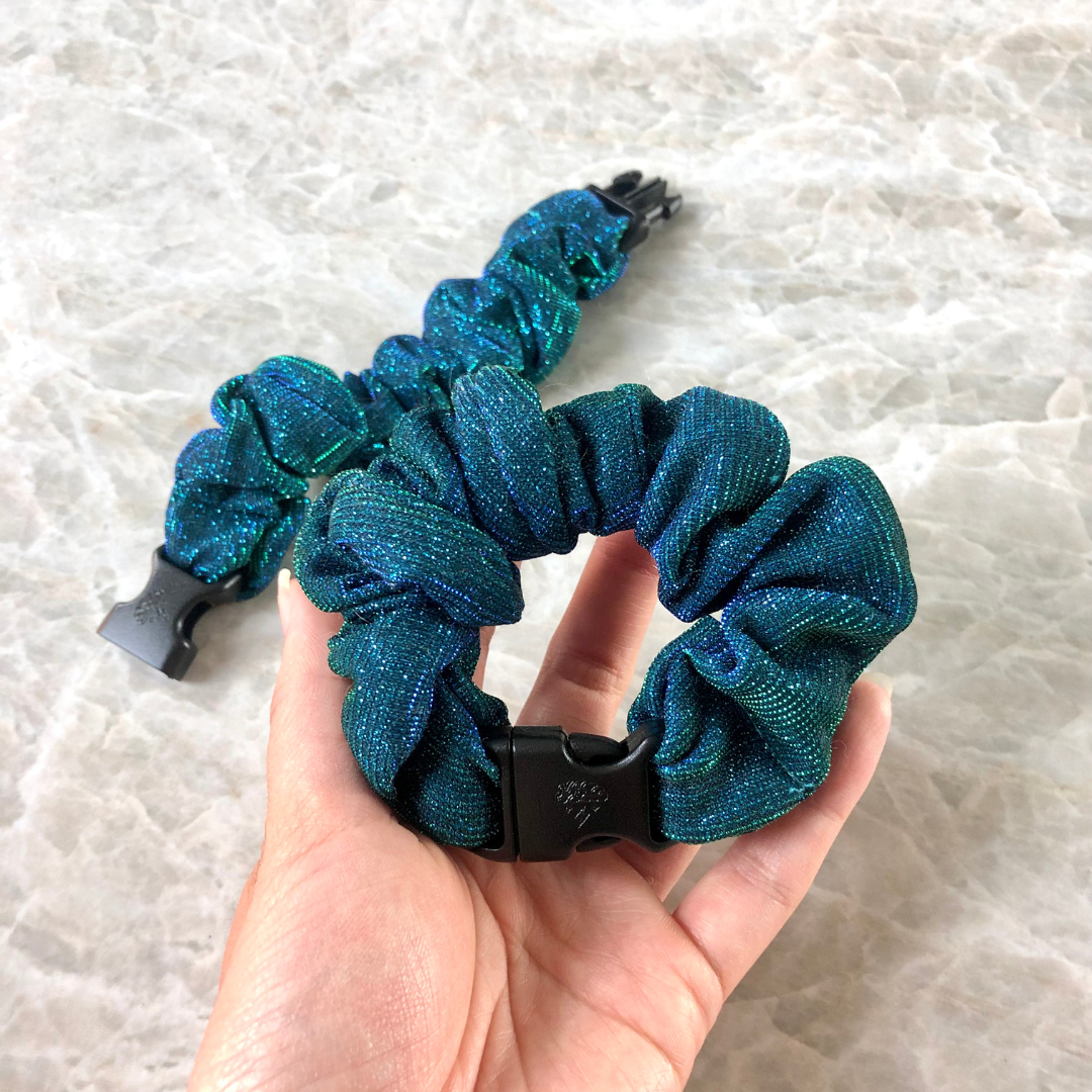 Best hair tie elastics and scrunchie hair accessories for snag-free, pull-free, rip-free, hair. Smooth, effortless hair ties and hair scrunchies for athletes, active moms, fitness, & sports. Mystic Mermaid Teal Buckle Scrunchie - No Snagging, No Tangles Sparkly Teal Recycled Polyblend Standard (1.25 to 1.5 inch thickness)
