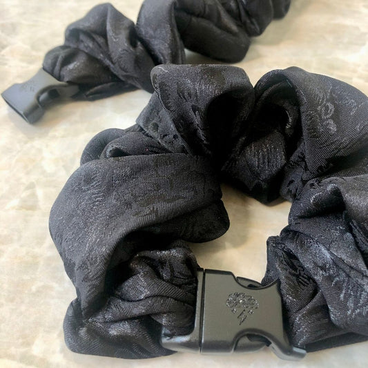 Best hair tie elastics and scrunchie hair accessories for snag-free, pull-free, rip-free, hair. Smooth, effortless hair ties and hair scrunchies for athletes, active moms, fitness, & sports. Ornate Floral Buckle Scrunchie - No Snagging, No Tangles Ornate Black Recycled Satin Standard (1.25 to 1.5 inch thickness)