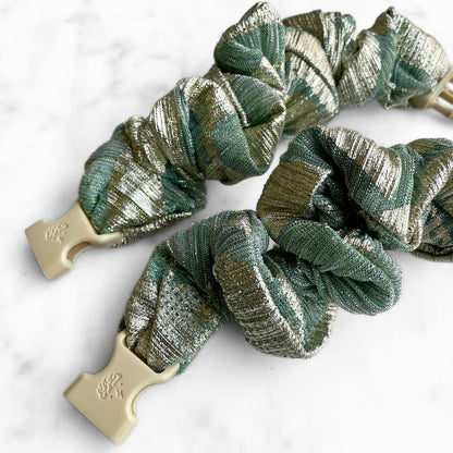 Best zero tangle no pull hair tie elastics and scrunchie hair accessories for snag-free, pull-free, rip-free, hair. Smooth, effortless hair ties and hair scrunchies for athletes, active moms, fitness, & sports. Gilded Sage Buckle Scrunchie - No Snagging, No Tangles