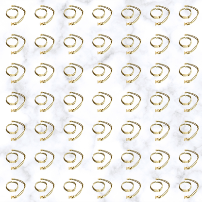 Grid of Champagne Blonde Buckle Hair Tie elastics on marble, 100-pack bulk team pack for gyms, studios, and sports teams