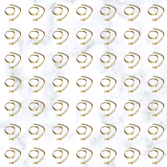 Grid of Champagne Blonde Buckle Hair Tie elastics on marble, 100-pack bulk team pack for gyms, studios, and sports teams