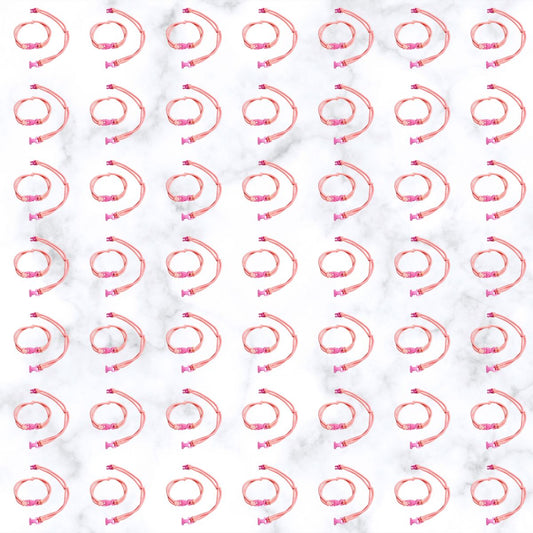 Grid of Baby Pink Buckle Hair Tie elastics on marble, 100 pack for cheer, volleyball, and Pink Out games