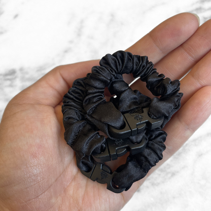 BABY Buckle Scrunchie shown at 4 inches long next to a standard size