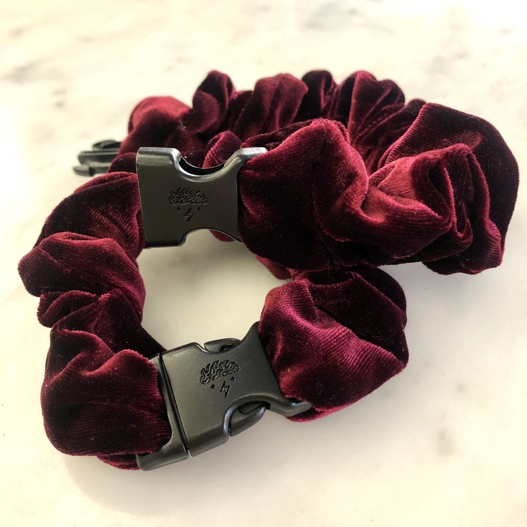 Deep bordeaux velvet texture on the Holiday Buckle Scrunchie