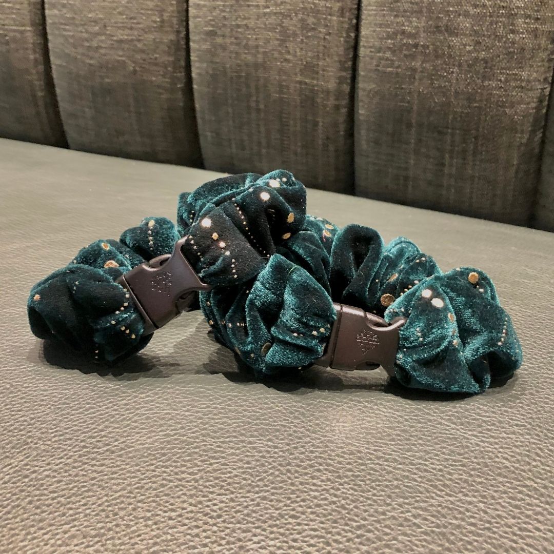 Deep green recycled velvet texture on the Jingle Green Buckle Scrunchie