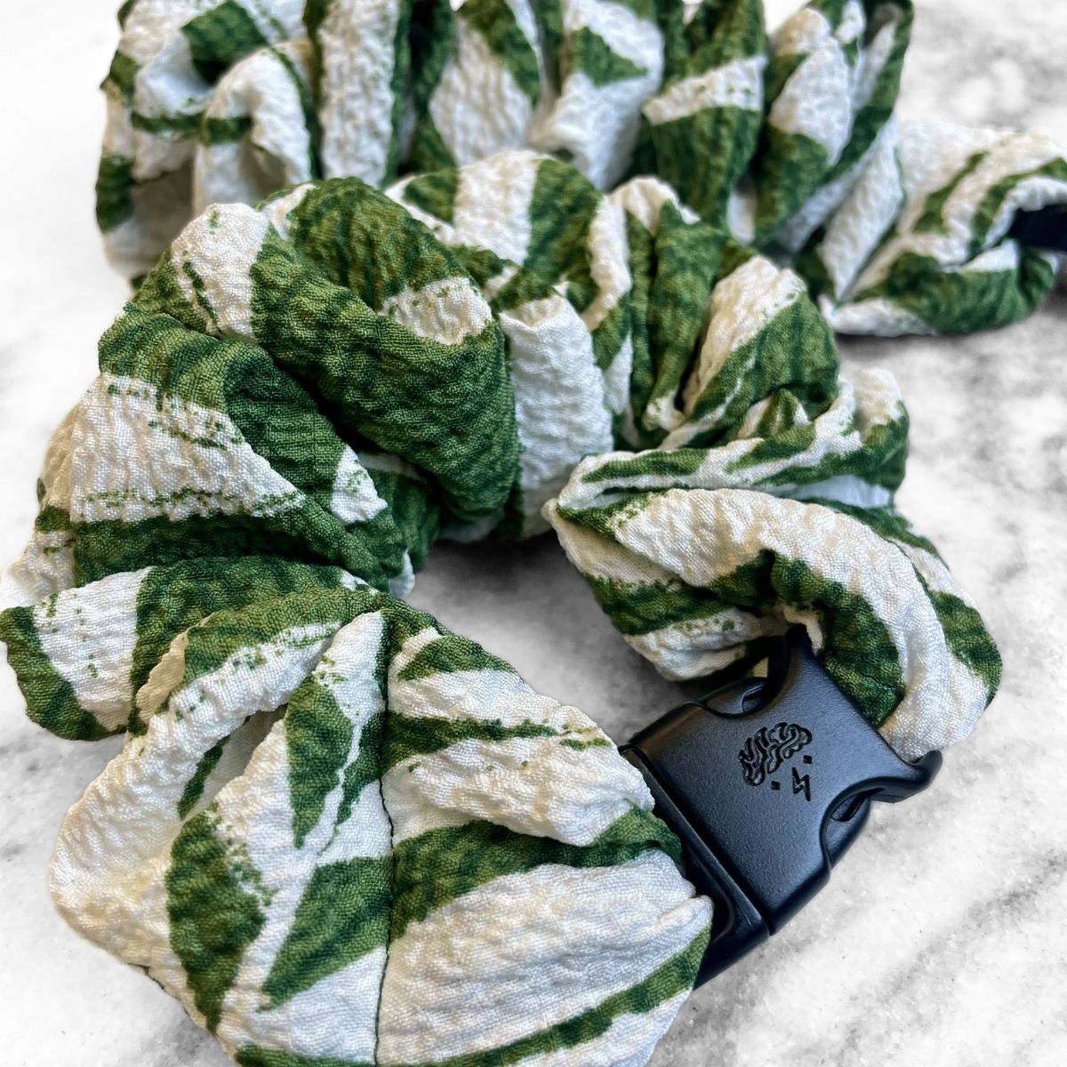 Green leaf print fabric detail on the Leafy Buckle Scrunchie