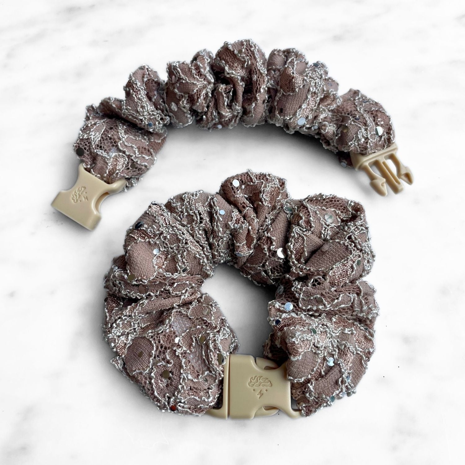 Mauve lace Buckle Scrunchie with silver embroidery and a tan quick-release buckle