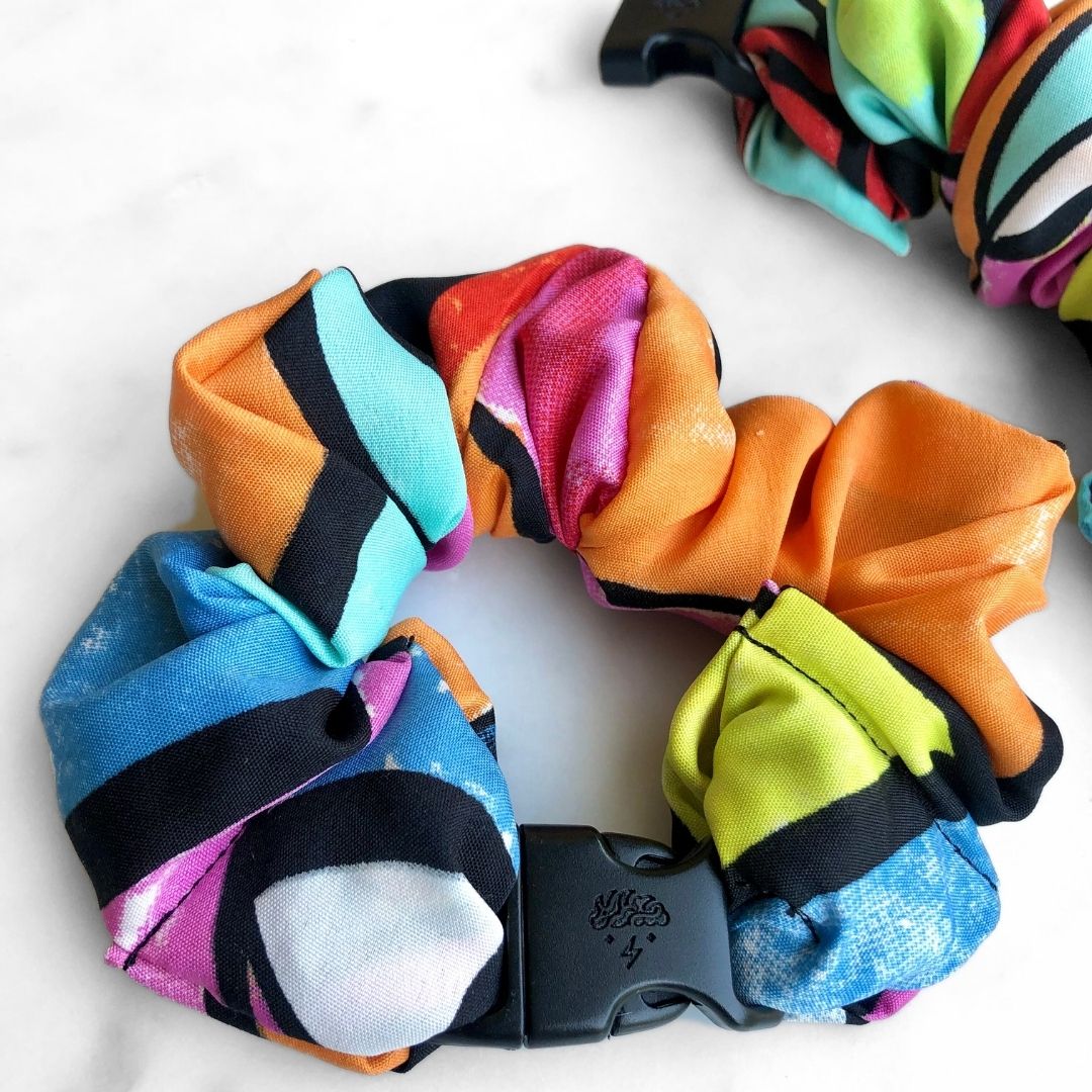 Neon pink, orange, and blue fabric detail on the Miami Buckle Scrunchie