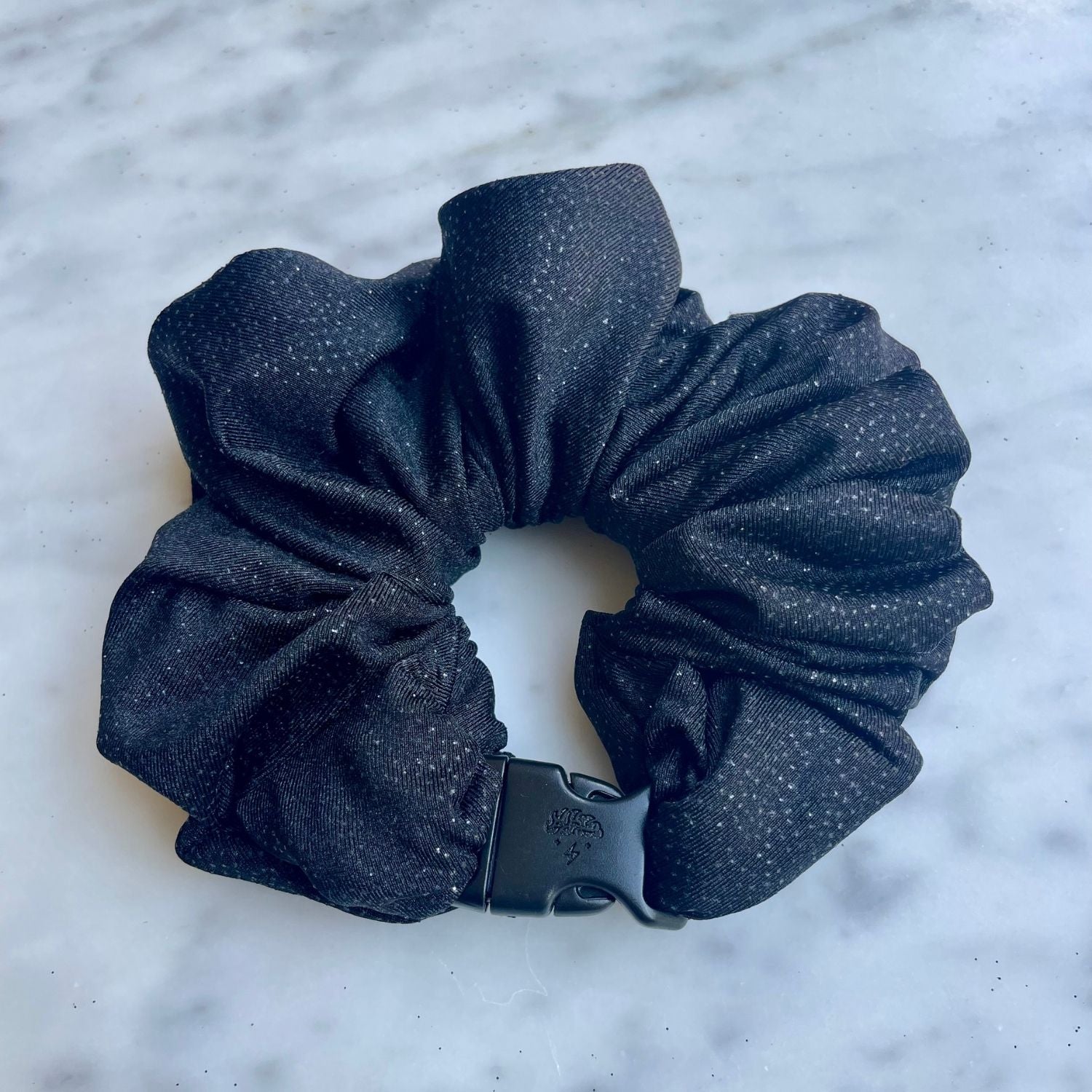 Single black glitter Buckle Scrunchie fastened with its buckle
