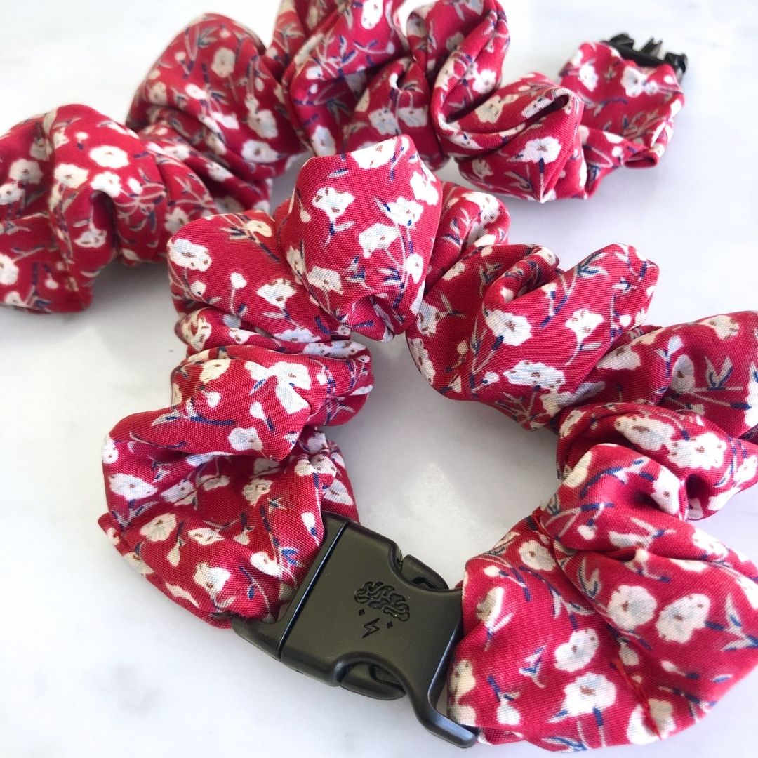Ruby Bloom Buckle Scrunchie in a deep red floral print