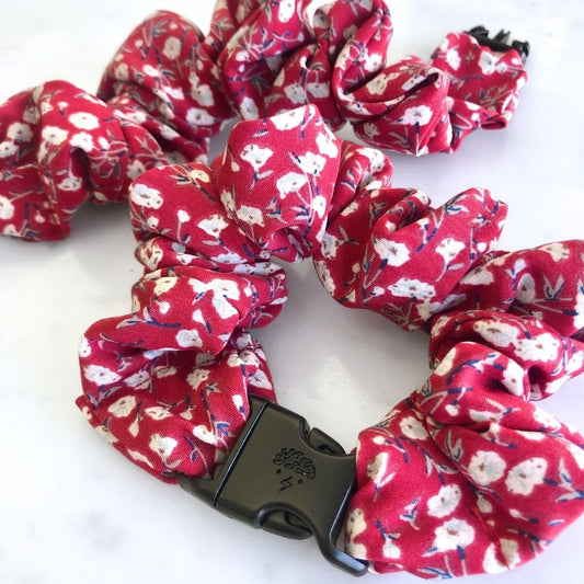 Ruby Bloom Buckle Scrunchie in a deep red floral print