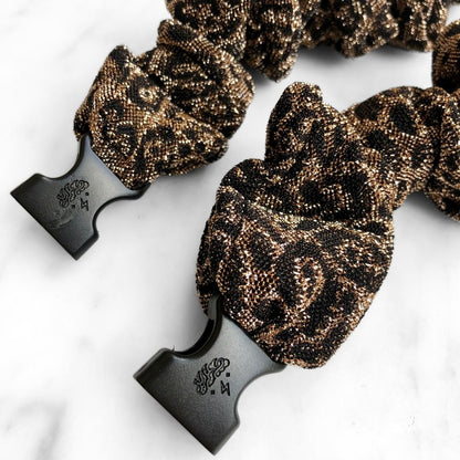 Sparkly leopard spot fabric detail on the Spotted Spark Buckle Scrunchie