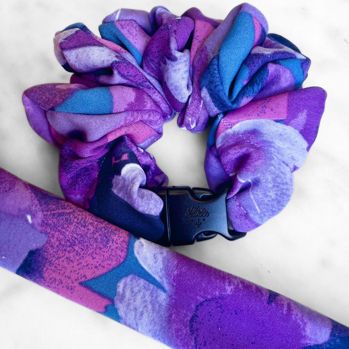 Purple floral print fabric detail on the Twilight Garden Buckle Scrunchie
