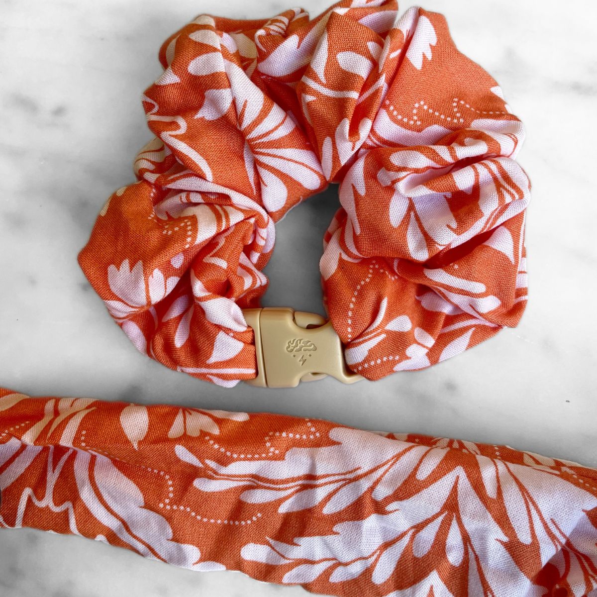 Valencia Orange jumbo Buckle Scrunchie with its quick-release buckle