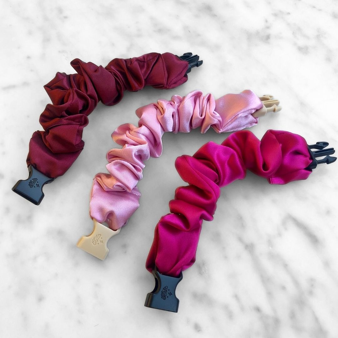 Red and pink satin Buckle Scrunchies arranged as a Valentine's gift