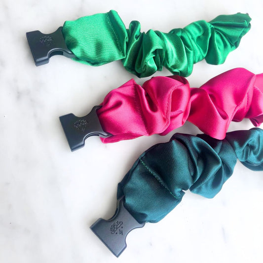 Three Buckle Scrunchies in watermelon pink, green, and red recycled satin